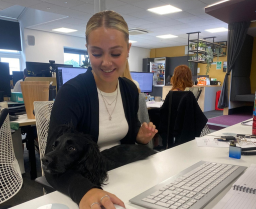 Rosie Alty with a small black dog