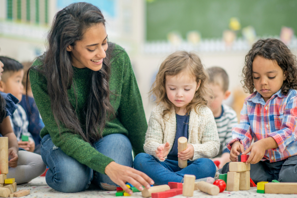 A teaching professional playing with children