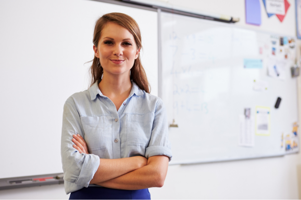 A young teaching professional looking at the camera