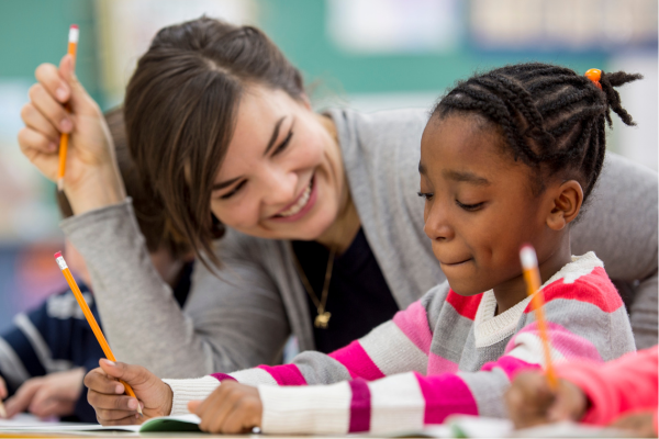 A teaching professional sat with a child