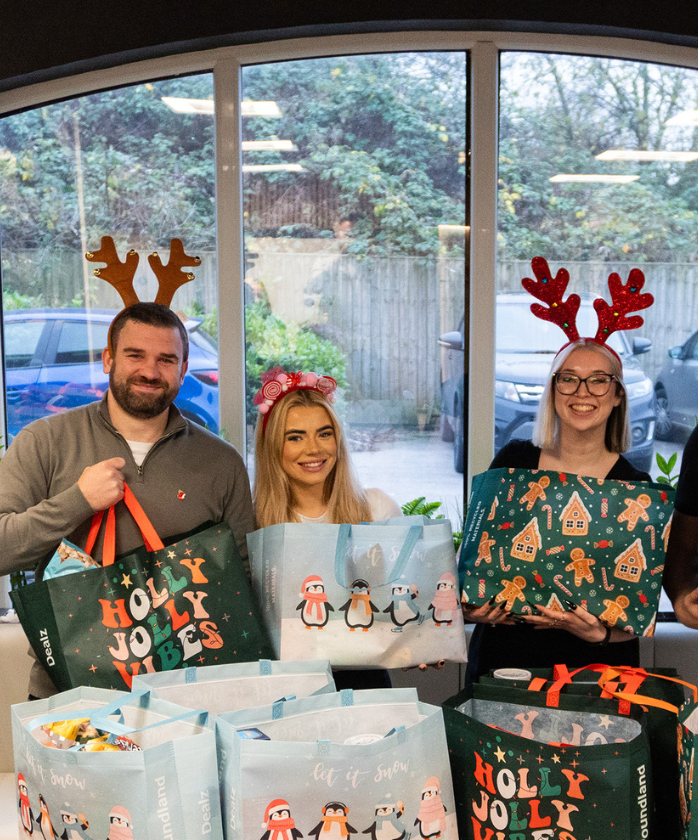 Spencer Clarke Group employees with Christmas hampers for charity 