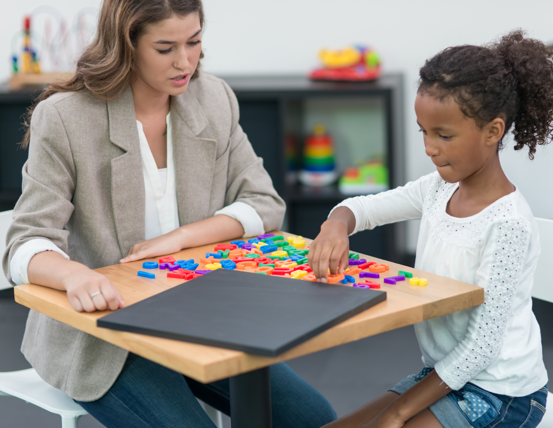 A female professional helping a little girl