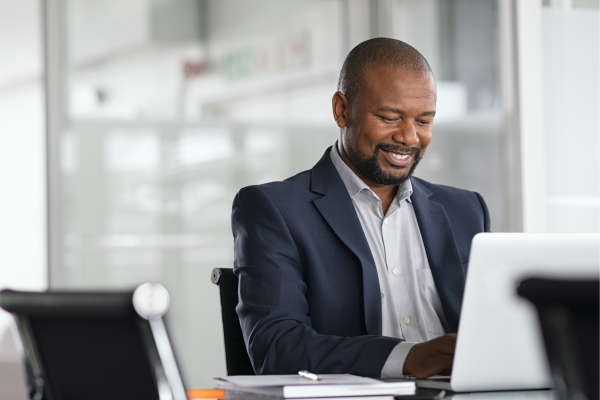 A man sat at a desk working