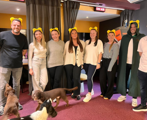 Emma Dobson wearing Children in Need Pudsey ears with colleagues