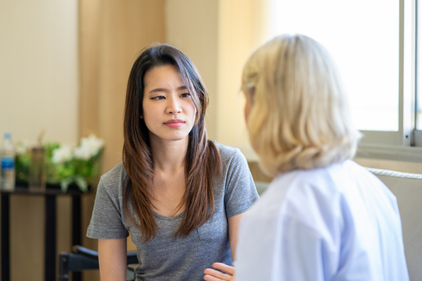 A female professional having a chat with a young woman