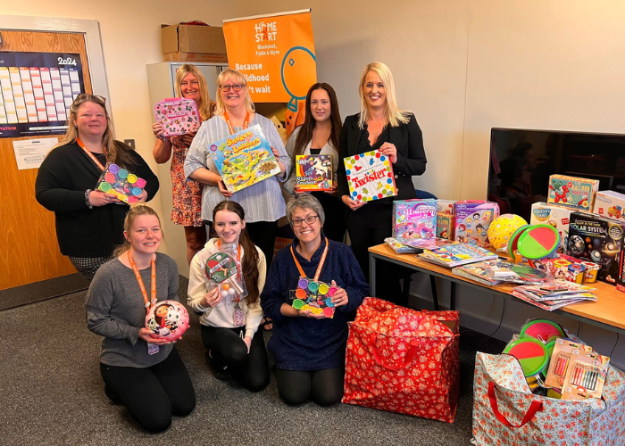 SCG education team with a collection toys