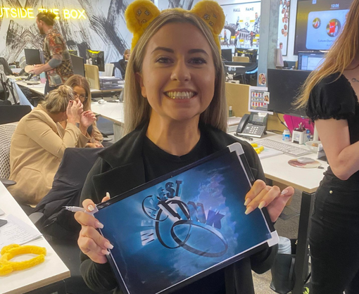 A female Spencer Clarke Group employee wearing yellow teddy bear ears for Children In Need