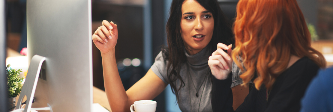 Two young women engaging in conversation