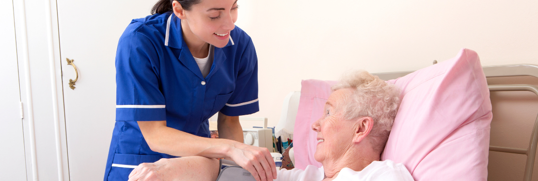 A healthcare professional helping an elderly lady