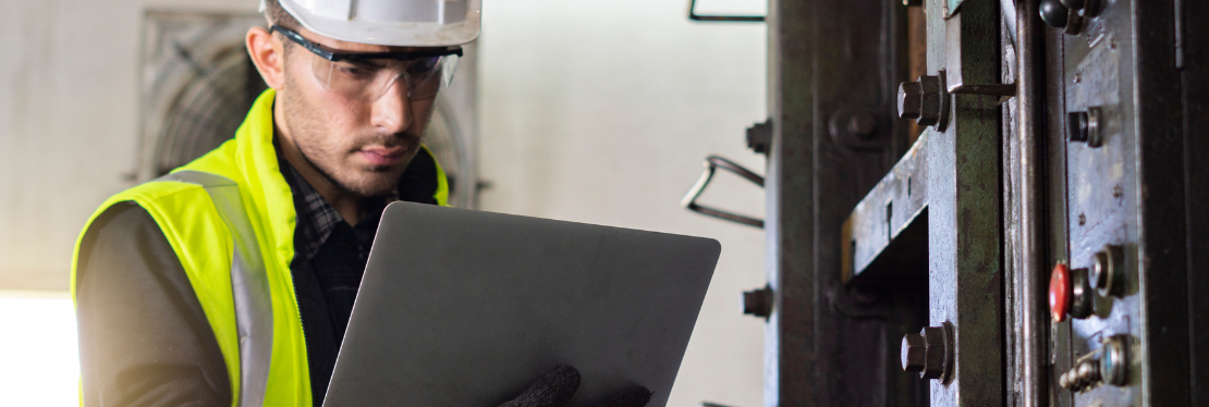 A male engineer looking at a screen