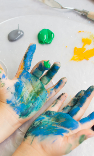 A pair of childs hand with paint on