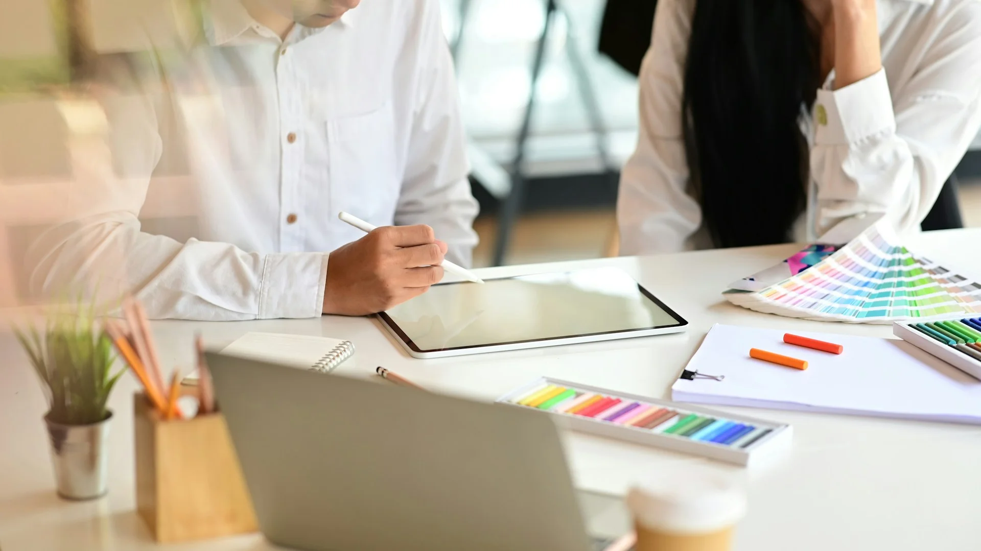 cropped-shot-creative-team-working-with-tablet-and-meeting-colouring-project