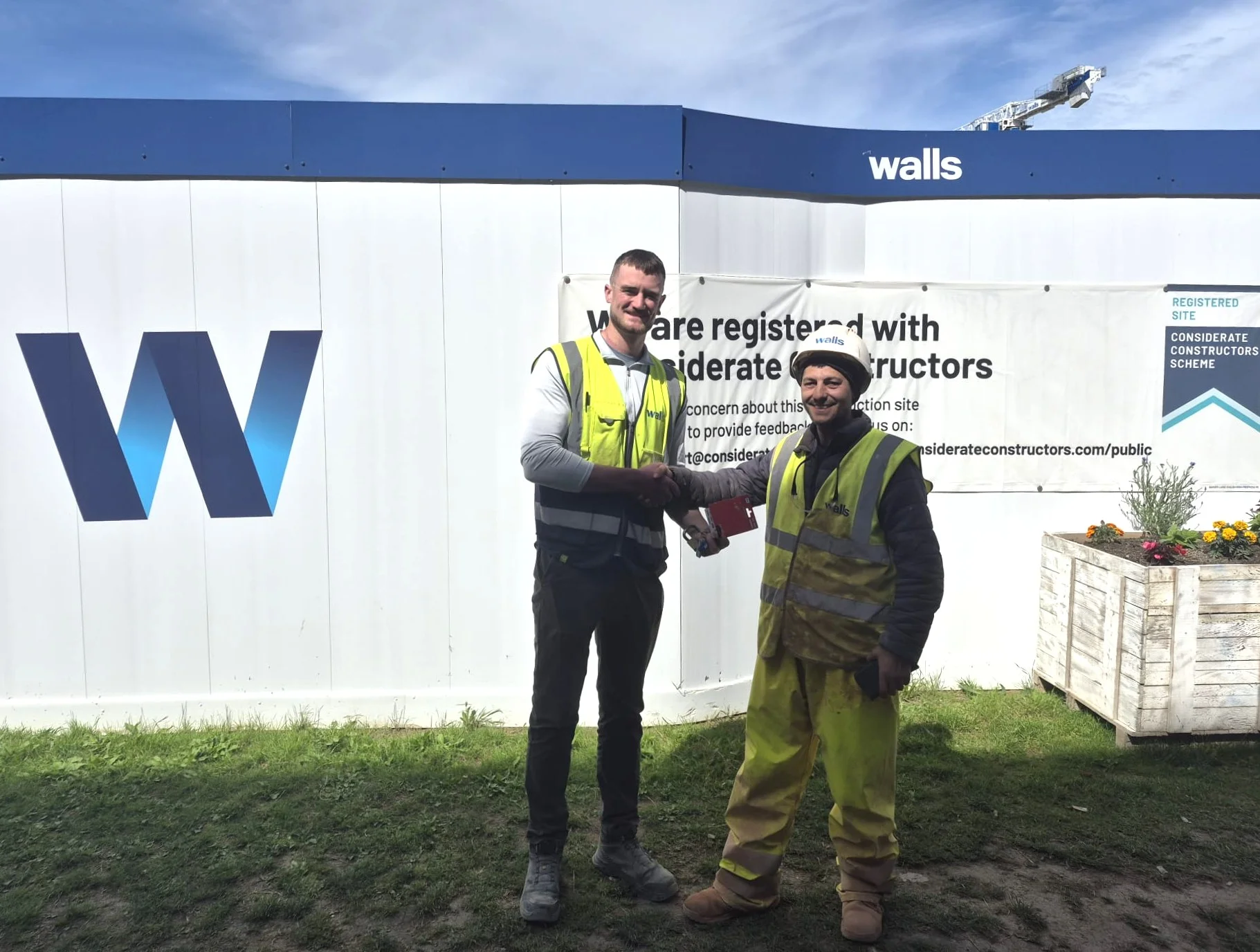 Florin receives his award from Denis (left) at the Clongriffin site