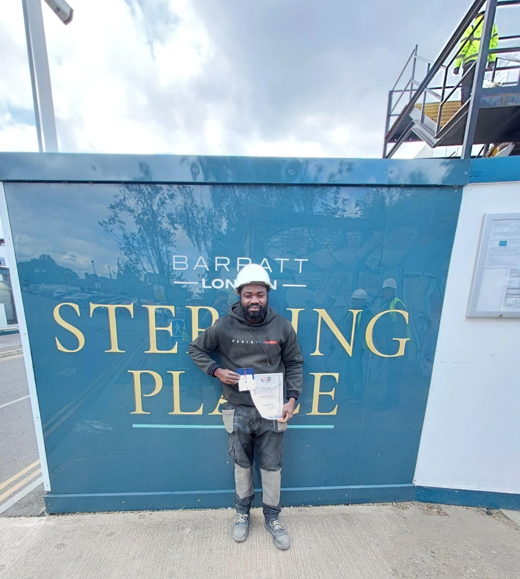 Richmond displays his award at the Barratt - Sterling Place site