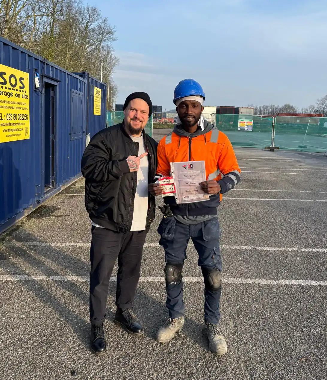 Jide displays his award alongside Mark Atkins at the Nursling site