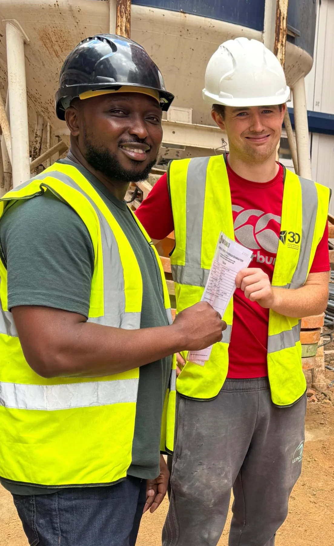 Tamba presents Padraig with his award at the Hackney Wick site