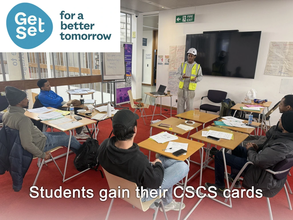 Damola giving his presentation to students