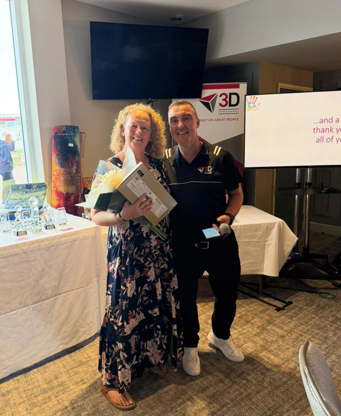 Janet Facer from Boundary Lakes Golf Club receives a presentation from Damian on the day