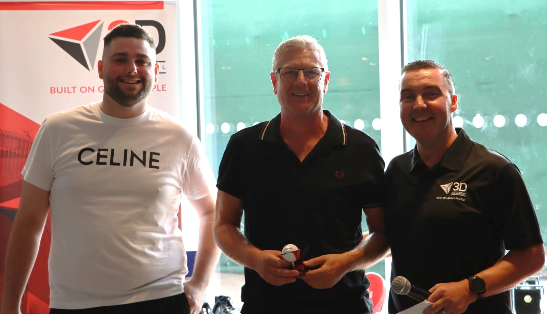 Steve Perkins who got nearest to the pin, with Connor and Damian from 3D