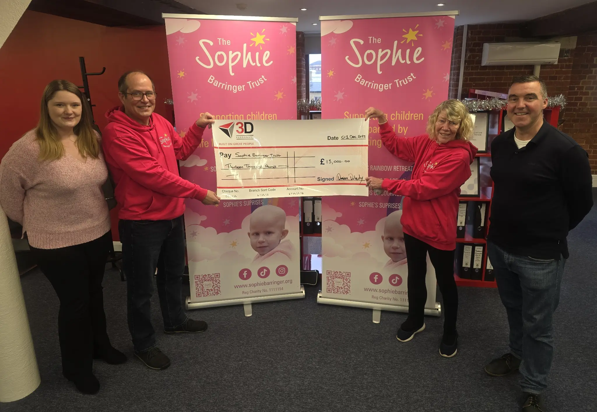 Laura, Mike, Lin and Damian at the presentation of the cheque for £13,000 following the 2025 fundraising campaign