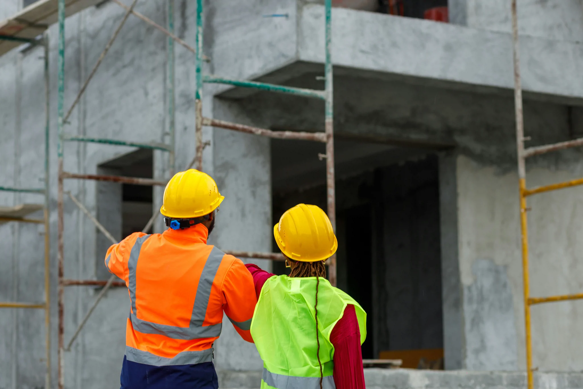 Site team inspecting building scaffolding