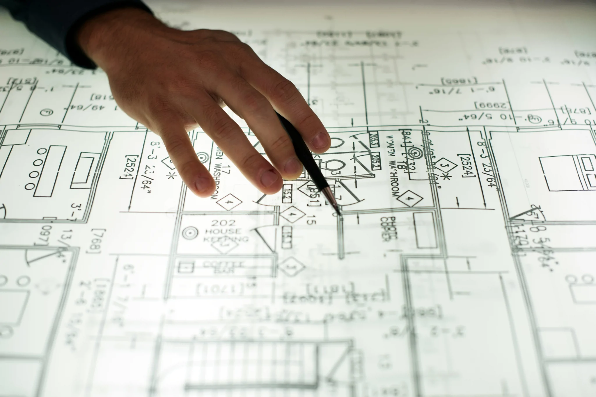 Reviewing detailed construction drawings