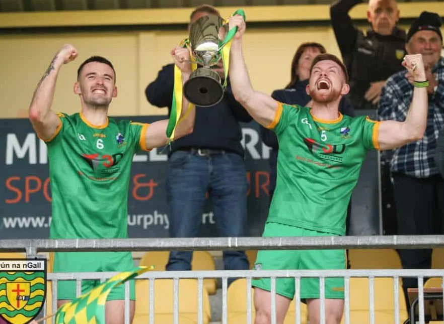 Philip and Pauric lift the Cathal McLaughlin Memorial Cup in 2025