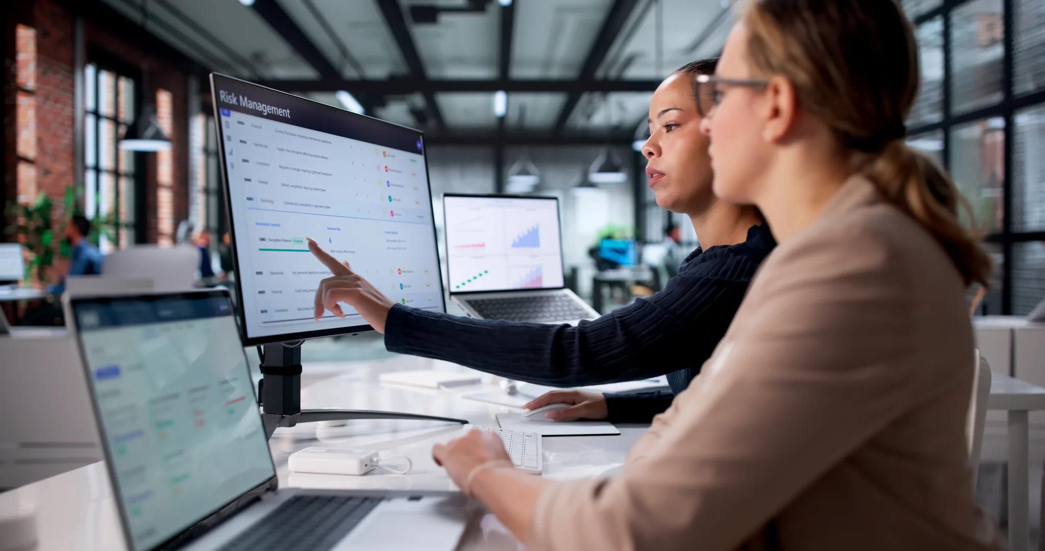 Image illustrating people analysing technology services