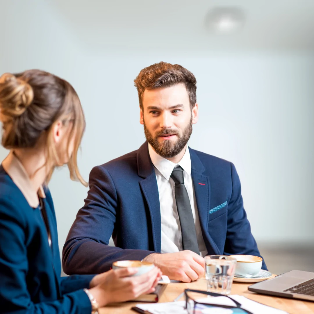 2 people at a table having a meeting