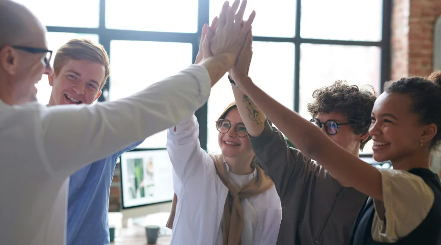 Colleagues giving each other a hi-five