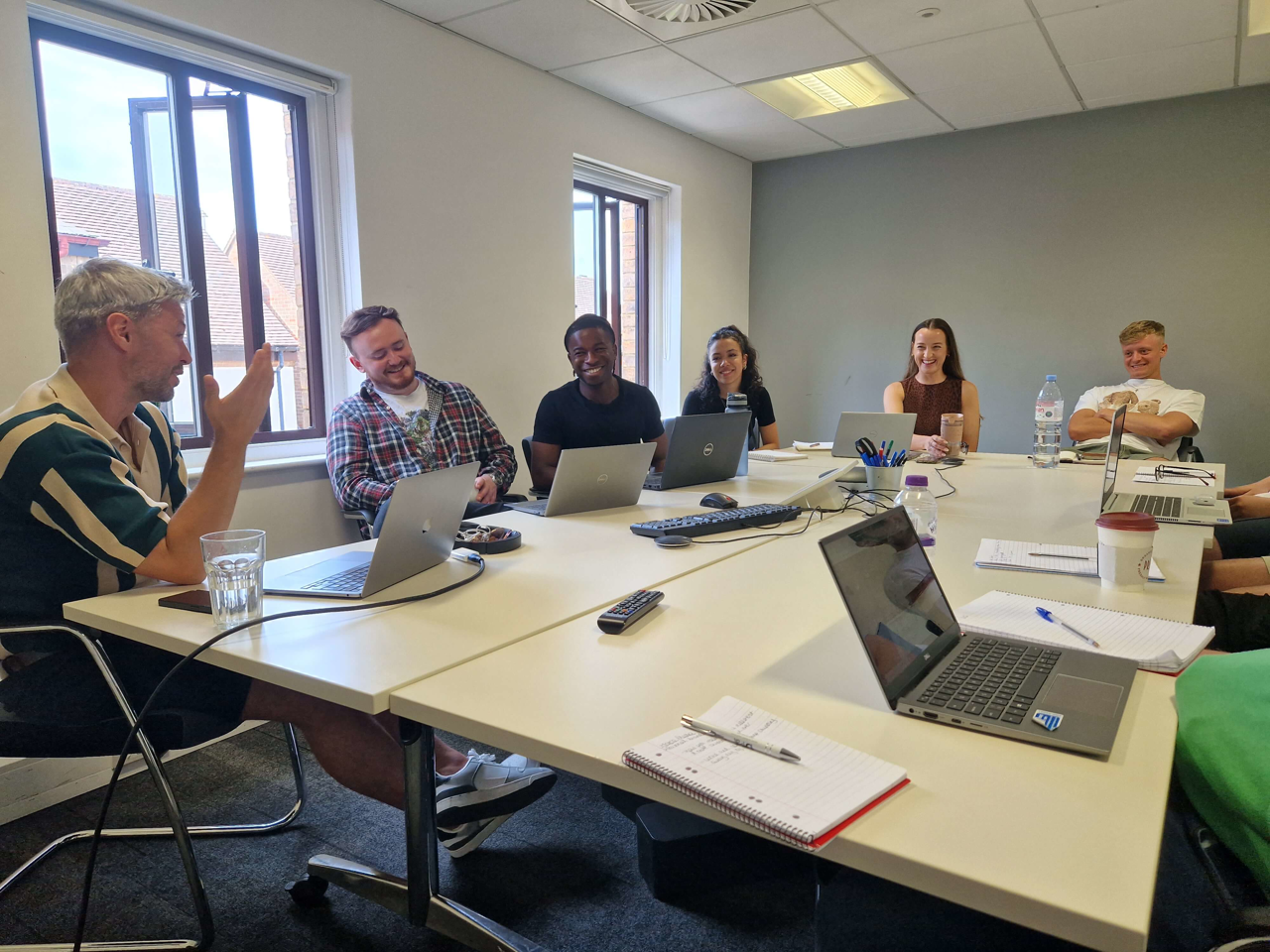 A group of people sitting in a meeting room