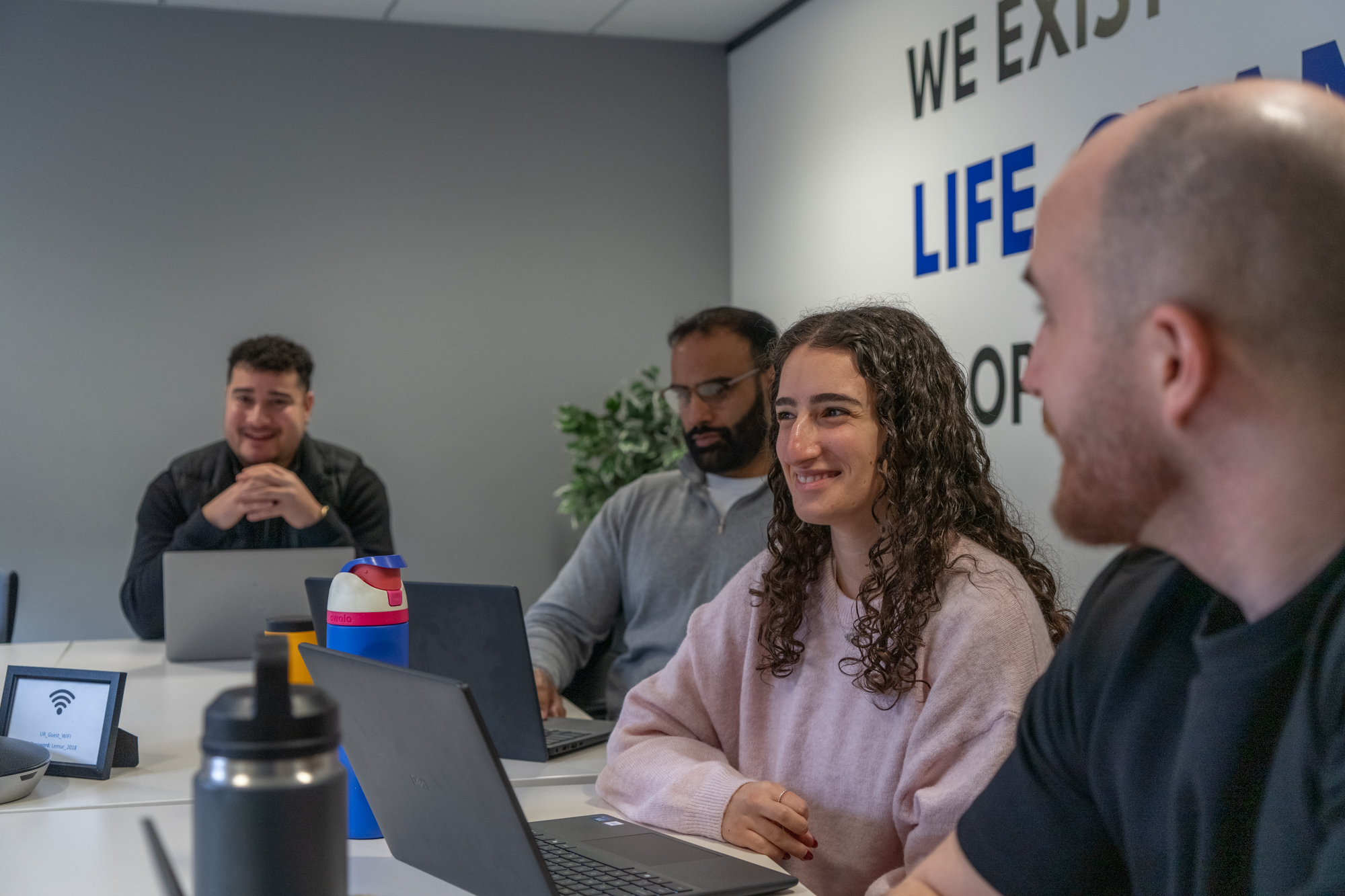 A group of people sitting in a meeting room
