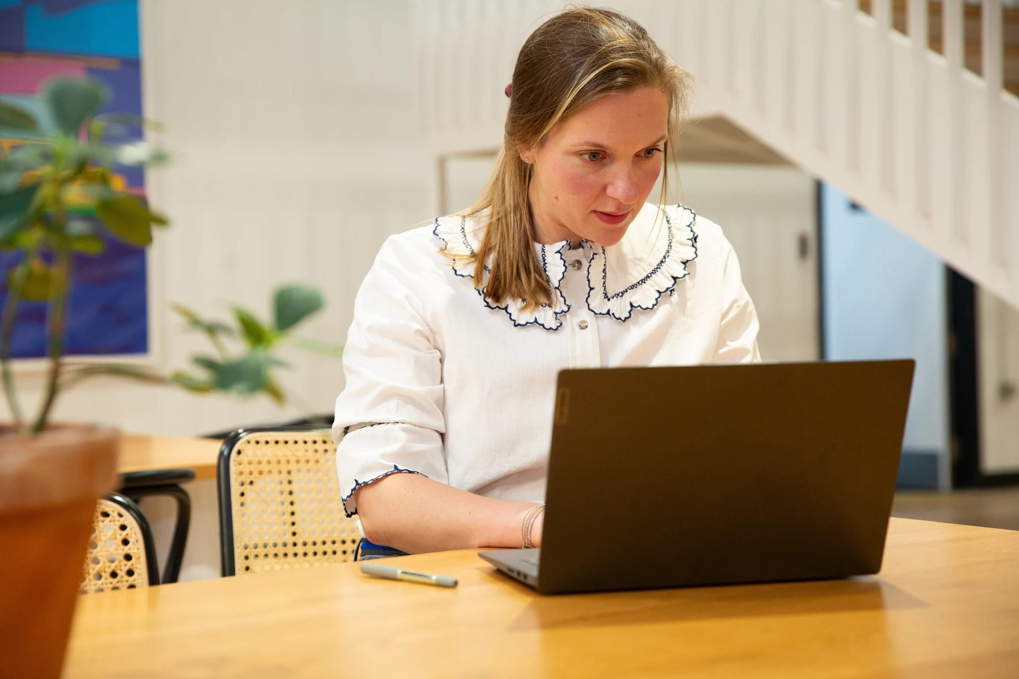 Woman working on laptop in office