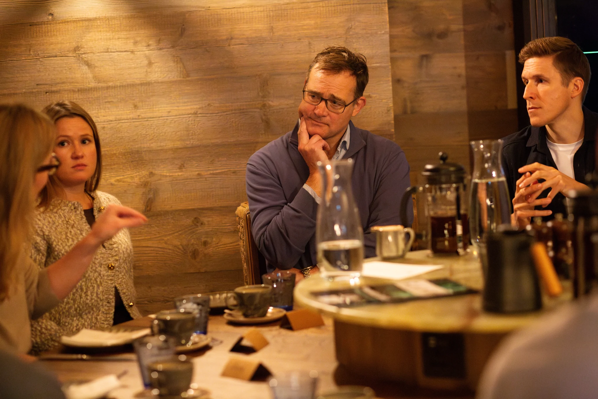 Four people sat round a table talking at an event