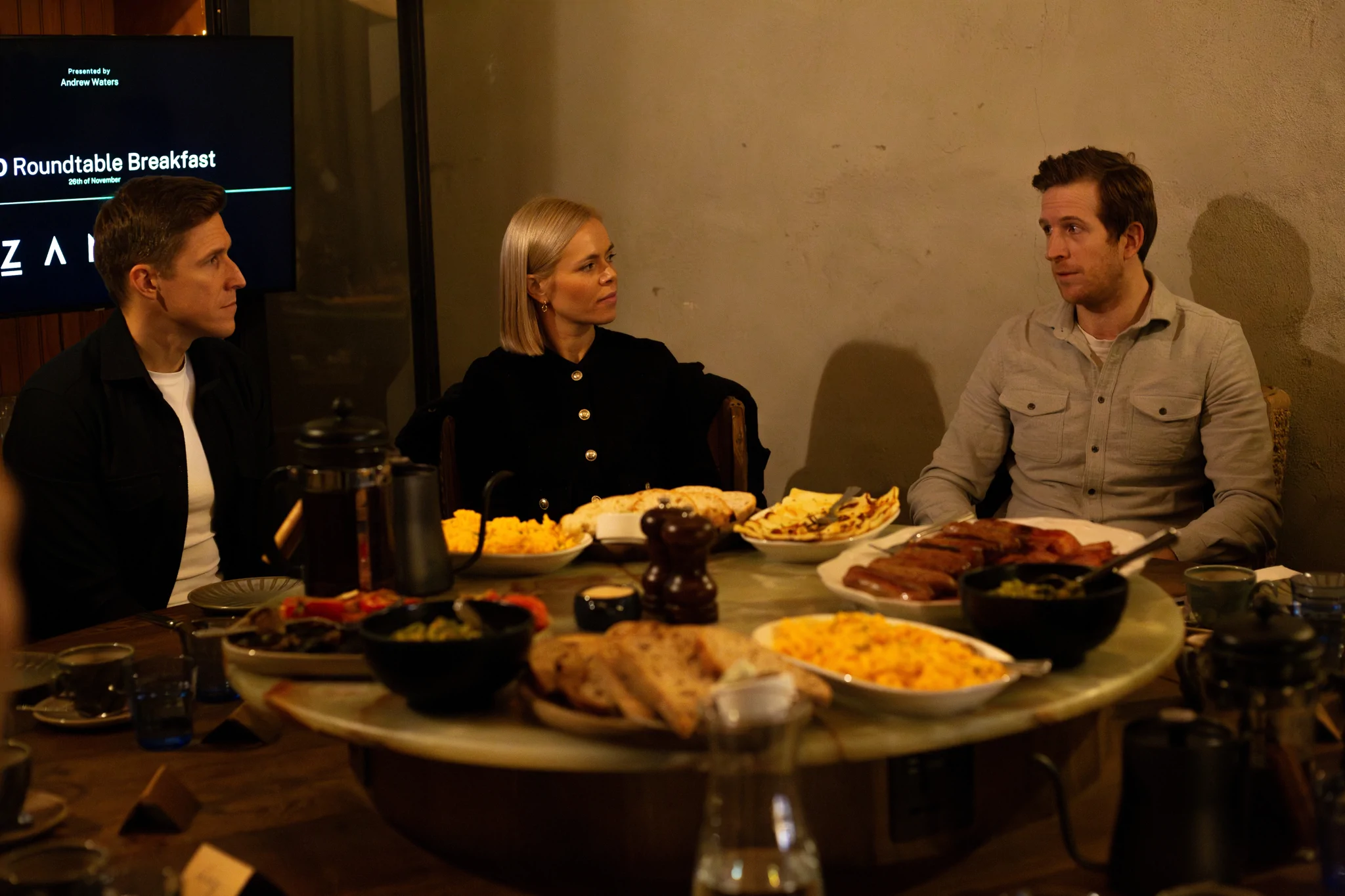 Two cfos and a founder talking at a roundtable breakfast
