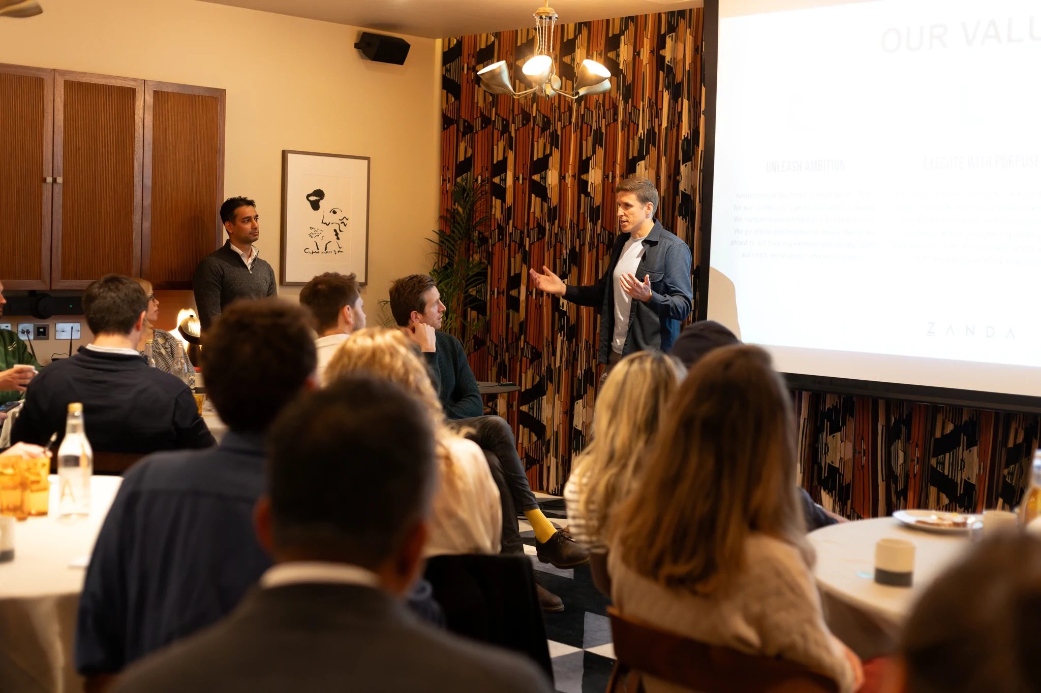 Andrew presenting to a room of CFOs